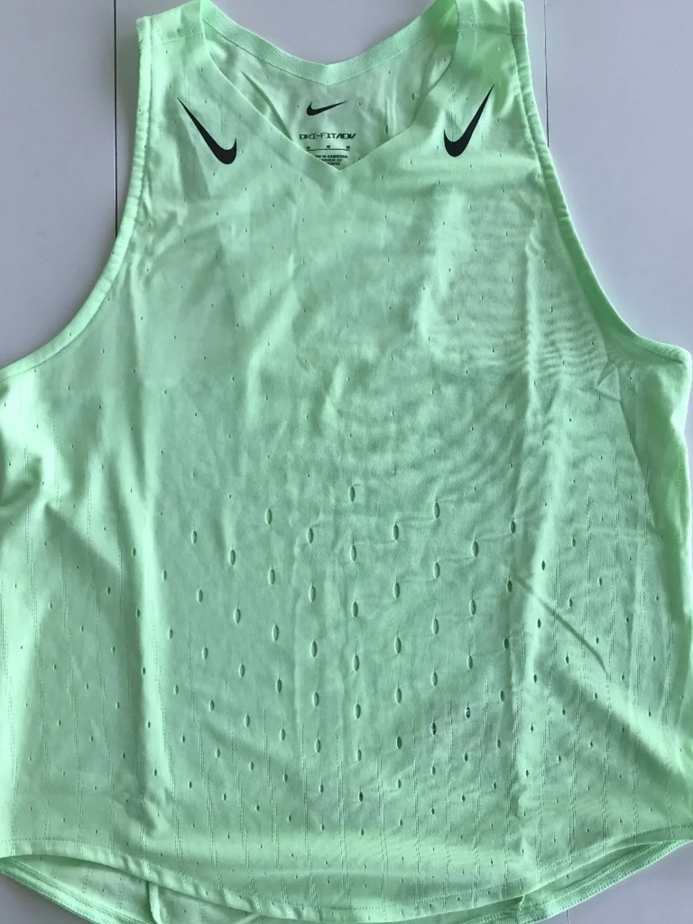 TWO Nike athletic tops. M, DRI Fit and laser cut patterns.